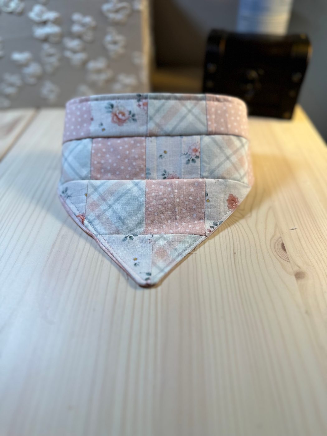Handmade pet bandana pieced from small blush, cream and sage squares — roses, plaids and dotted cottons — with an elasticated channel along the top