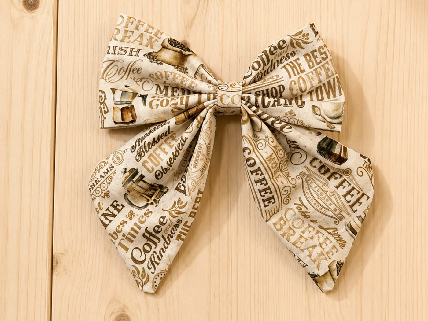 Handmade ivory sailor bow printed with vintage coffee-shop lettering