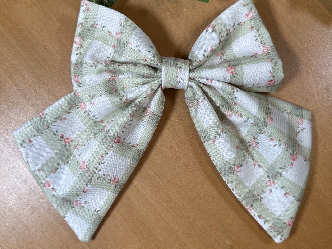 Handmade sage-green gingham sailor bow scattered with tiny roses
