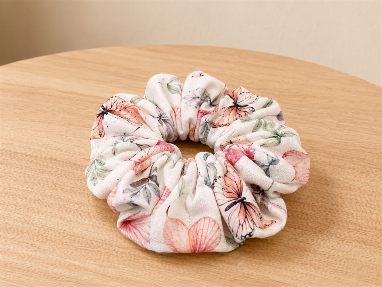 Handmade scrunchie in a cream butterfly print