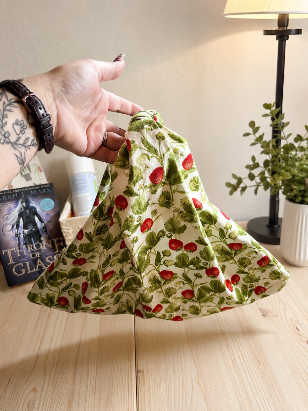 Handmade knot-style tote in a wild strawberry and vine print on cream